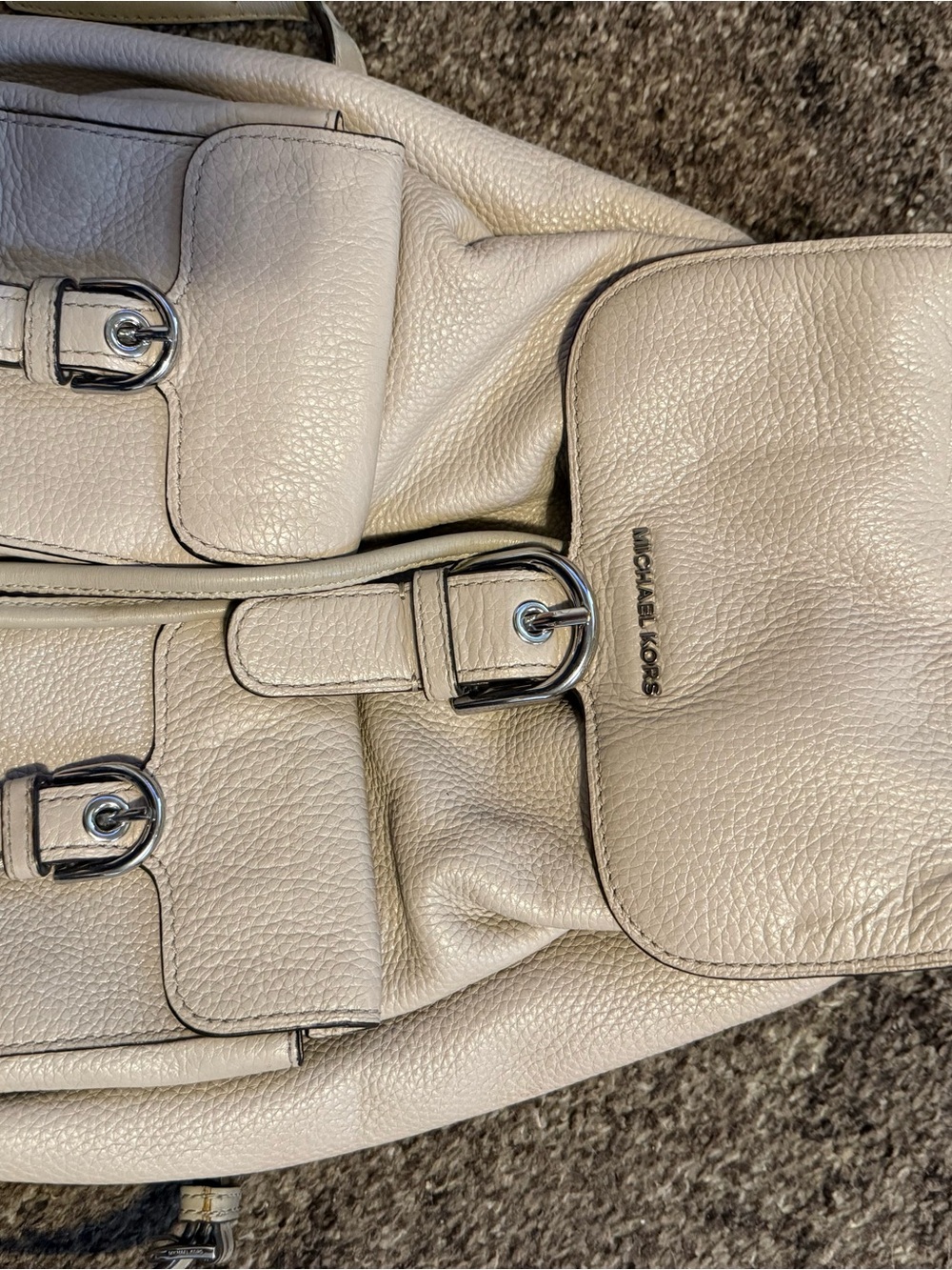 Michael Kors Cream Pebbled Leather Drawstring Backpack with Buckle Accents